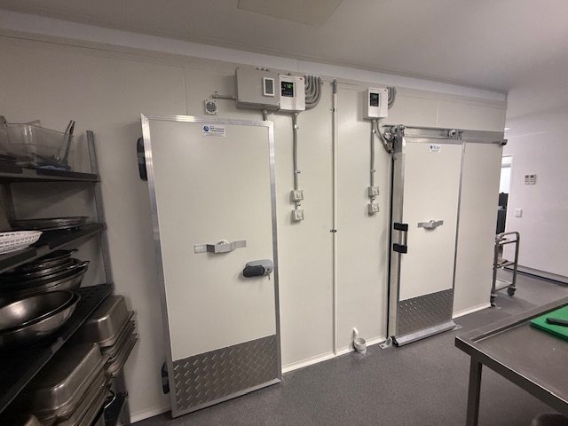 Completed commercial freezer and cool room including refrigeration equipment.